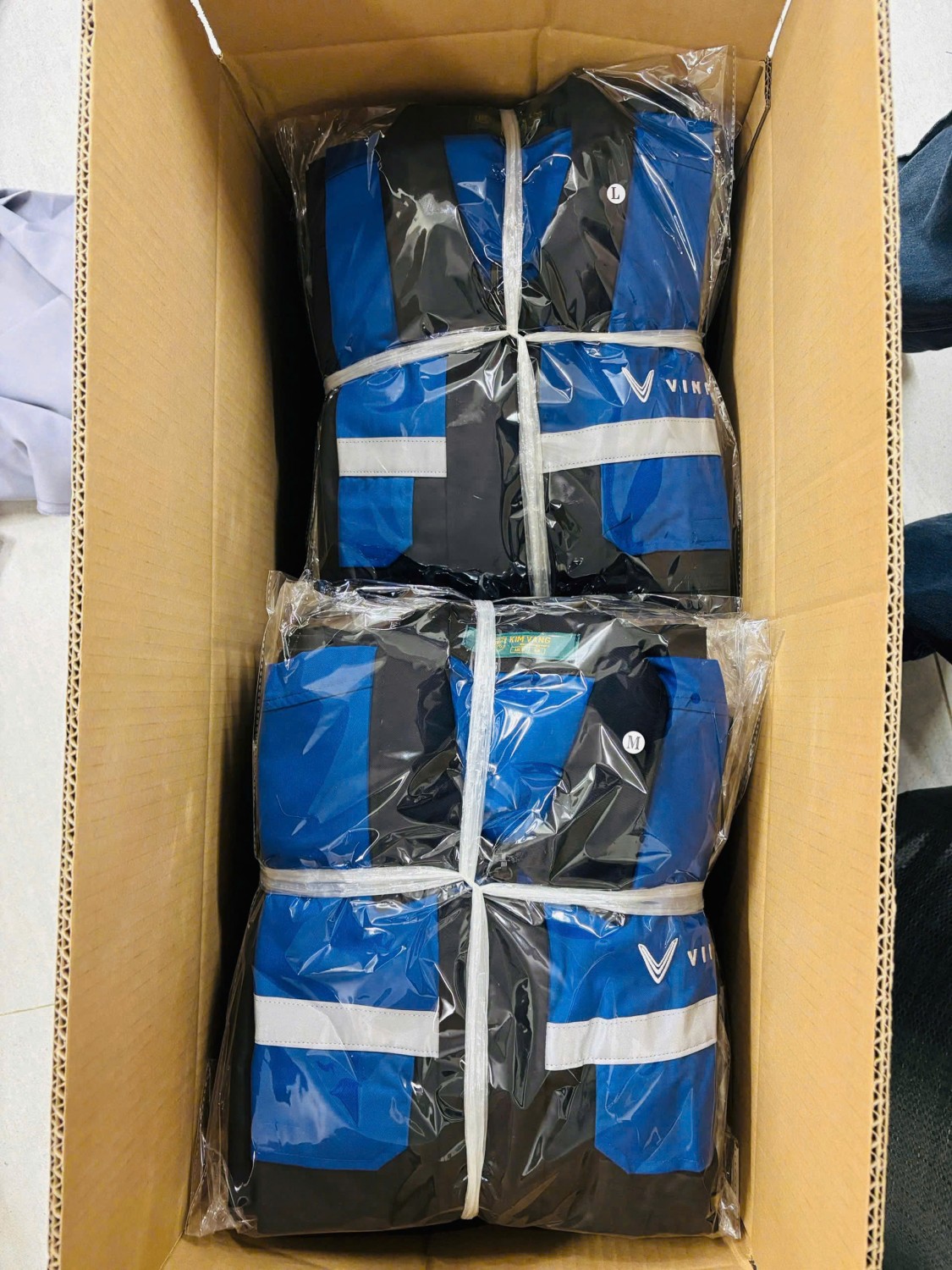 đóng gói đồng phục theo size sau khi QC
